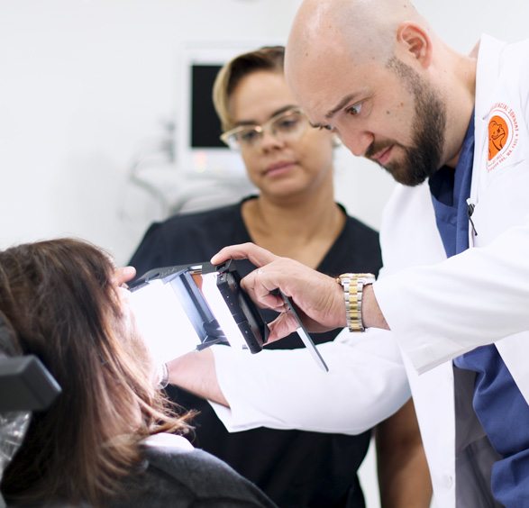 Oral surgeon taking a photo of a patient