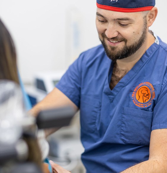 Oral surgeon talking to a patient about I V anesthesia in Roslyn