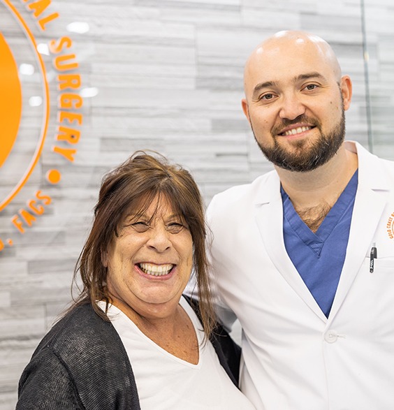 Woman smiling with her oral surgeon