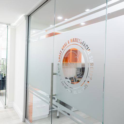 Logo on glass door for Gold Coast Oral and Maxillofacial Surgery Steve Yusupov D D S M D F A C S