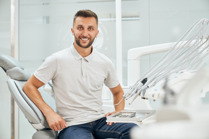 Male dental patient smiling before implant surgery