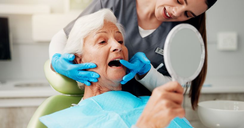 A woman at the dentist getting dental implants.